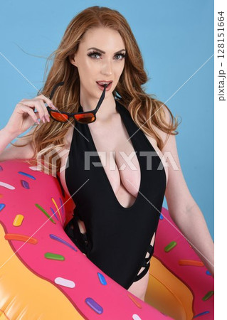 Beautiful redhead model dressed in various outfits for Summer 128151664