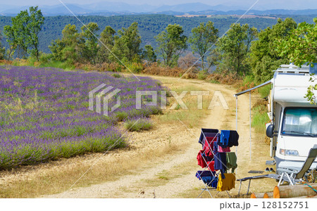 Clothes hanging to dry outdoors by camping car. Caravan vacation in France Clothes hanging to dry outdoors by camping car. Caravan vacation in France 128152751