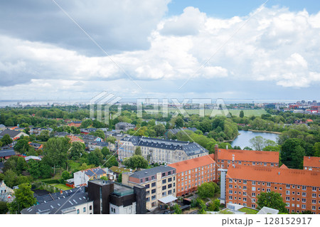 Panoramic view of the center of Copenhagen and the seaside with many windmills on the horizon. View from the top of the Church of our Savior. Panoramic view of the center of Copenhagen and the seaside with many windmills on the horizon. View from the top of the Church of our Savior. 128152917