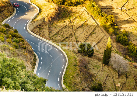 Winding asphalt road in France Winding asphalt road in France 128153313