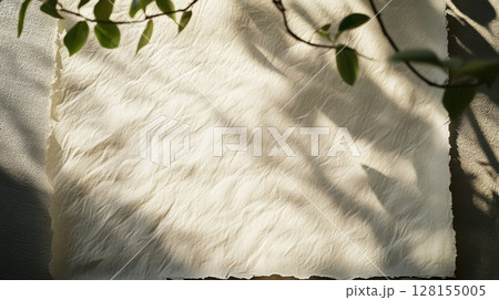 textured beige paper with leaf shadows textured beige paper with leaf shadows 128155005