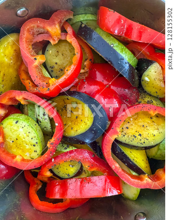 Colorful vegetables prepared for roasting in a stainless steel bowl Colorful vegetables prepared for roasting in a stainless steel bowl 128155302