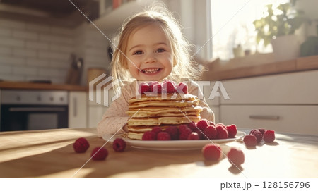 Happy Toddler with Pancakes and Raspberries 128156796