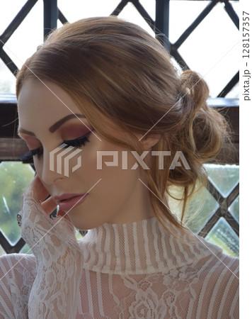 Beautiful, redheaded girl dressed in lace, posing in rooms of an old Manor House Beautiful, redheaded girl dressed in lace, posing in rooms of an old Manor House 128157357