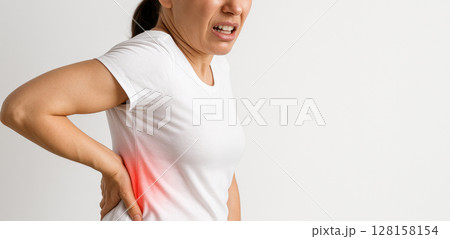 Woman pain back pain discomfort ache health injury white shirt adult female isolated expression suffering side casual standing studio human person upper body posture grimace muscle spine ache 128158154