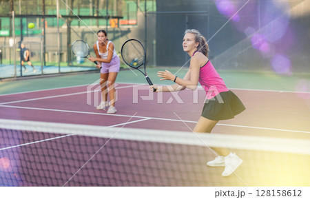 Portrait of emotional woman tennis player during friendly doubles couple match 128158612