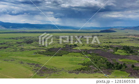 Steppe and mountains with rain landscape Steppe and mountains with rain landscape 128160538