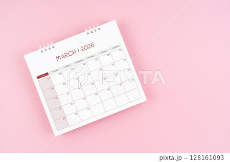 March desk calendar for 2026 year on pink background for schedule to make appointment meeting. 128161093