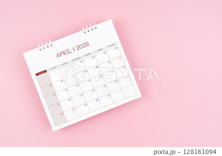 April desk calendar for 2026 year on pink background for schedule to make appointment meeting. 128161094