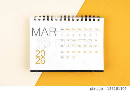 Desk calendar for March 2026 year on yellow color background, Flat lay. 128161105