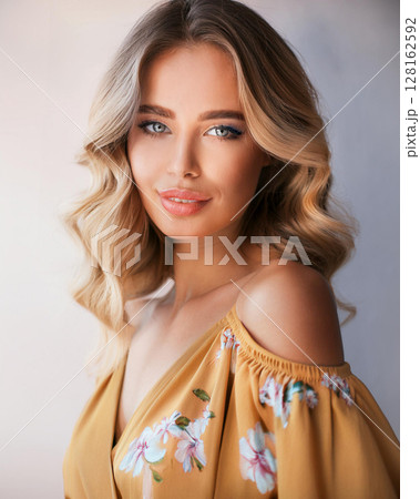 Graceful Young Woman in Floral Sundress 128162592