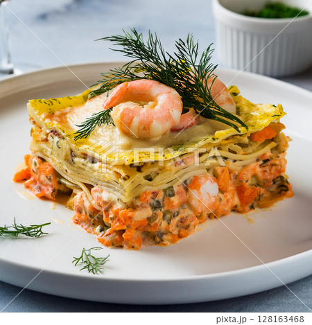 Seafood Lasagna Beautifully Garnished on Plate 128163468