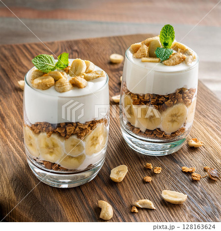 Delicious Banana Yogurt Parfaits on Table Delicious Banana Yogurt Parfaits on Table 128163624