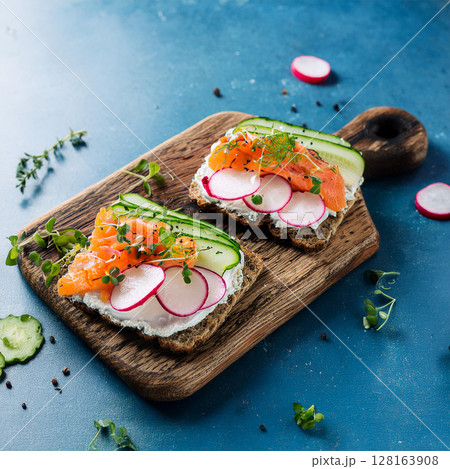 Fresh Open Faced Sandwiches on Rustic Board 128163908