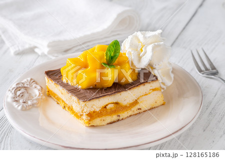 Square Mango Cheesecake With Chocolate Glaze, Fresh Cubes, and Whipped Cream Square Mango Cheesecake With Chocolate Glaze, Fresh Cubes, and Whipped Cream 128165186