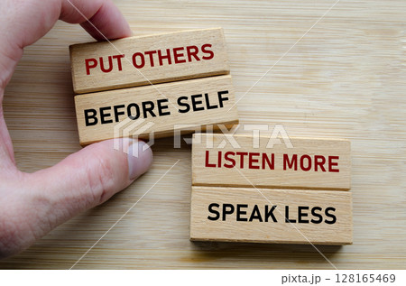 Put others before self message on wood cubes, highlighting a servant leadership mindset where empathy and humility come first Put others before self message on wood cubes, highlighting a servant leadership mindset where empathy and humility come first 128165469