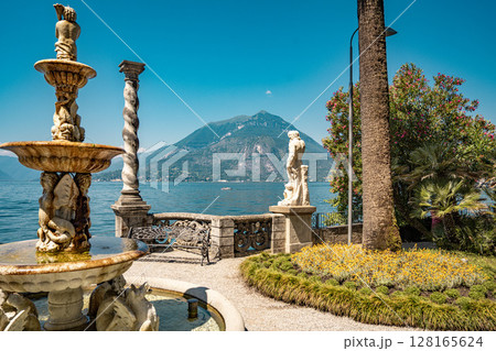 Lush Botanical Garden of Villa Monastero Overlooking Lake Como: Elegant Historic Estate Surrounded by Mediterranean Flora and Alpine Scenery 128165624