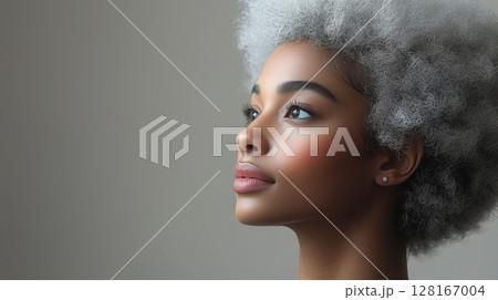Black woman with light-colored blonde white hair, stylish hair dyeing process. Banner with copy space, beauty salon 128167004