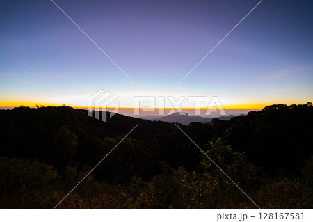 The beautiful sunrise at Doi intanon national park, Chiang Mai in the morning.Sun is rising from the hill to shy with beautiful yellow orange light. 128167581