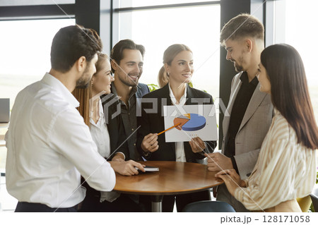 Group of business people sitting at desk on workplace on meeting discussing finance growth. 128171058