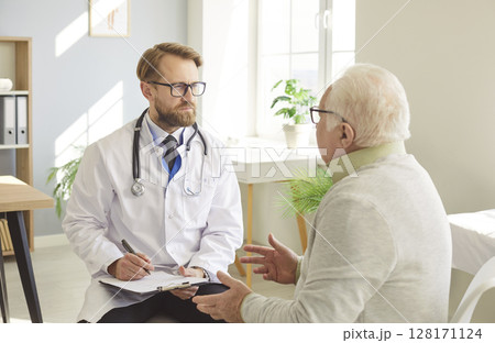 Doctor Talking To Senior Patient In Hospital Doctor Talking To Senior Patient In Hospital 128171124