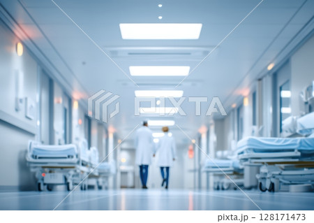 Healthcare Professionals Walking Through a Modern and Spacious Hospital Corridor 128171473