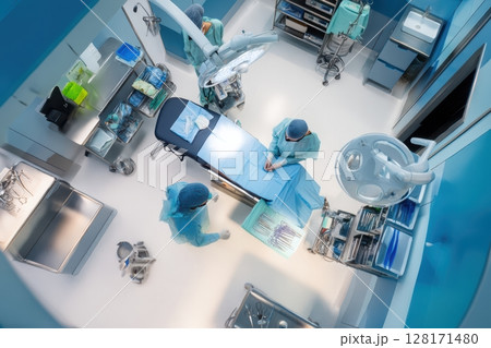An Overhead View of a Surgical Team in an Operating Room Performing a Complex Procedure 128171480