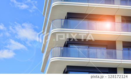 Downtown modern residential architecture. Architectural details of modern apartment building. Modern european residential apartment building complex. Downtown modern residential architecture. Architectural details of modern apartment building. Modern european residential apartment building complex. 128172124
