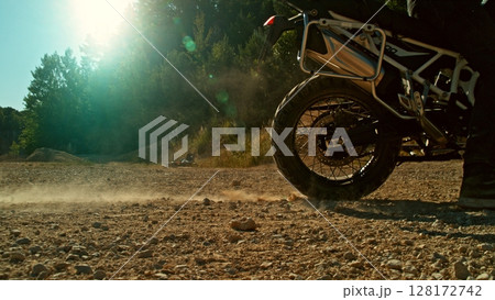 Detail view of the wheel of motocross bike. Freeze motion of exploding clay. 128172742