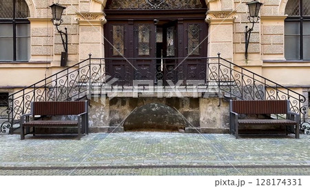 An elegant entrance of a historical building showcasing sophisticated architectural design and style 128174331