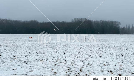 A Serene Quiet Winter Landscape Showcasing SnowCovered Fields Under an Overcast Sky 128174396