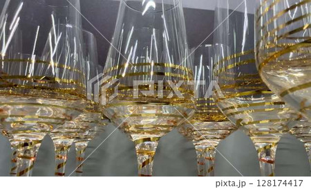 Beautiful and stylish glassware featuring luxurious gold accents that enhance any occasion 128174417