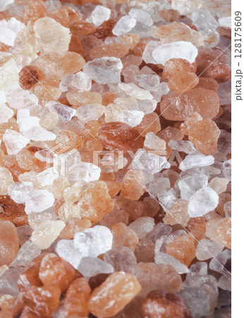 Close-up view of Pink Himalayan Salt on Bright colors textured surface. 128175609