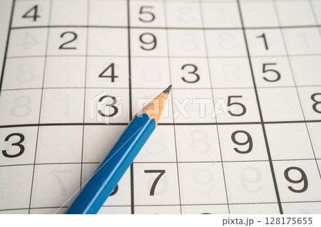 Sudoku puzzle game playing to challenge brain. Sudoku puzzle game playing to challenge brain. 128175655