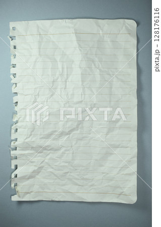 crumpled line paper texture on grey background,  blank sheet notebook 128176116