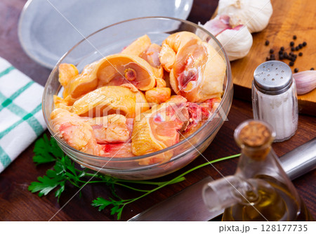 Bowl with raw sliced chicken, food preparation Bowl with raw sliced chicken, food preparation 128177735