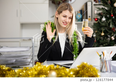 Woman having video call in office during Christmas 128177844