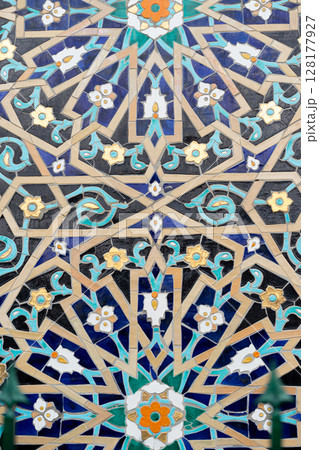 Colorful Geometric Islamic Tilework Decoration with Intricate Patterns and Floral Designs Colorful Geometric Islamic Tilework Decoration with Intricate Patterns and Floral Designs 128177927