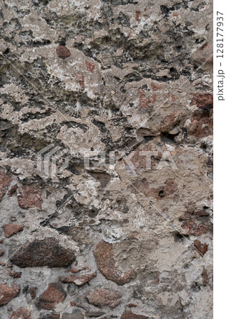 Old stone pavement background, abstract pavement, large cobblestones, old road texture. 128177937