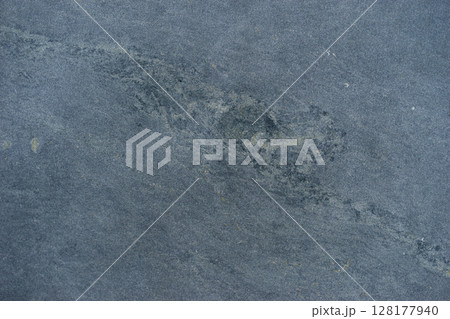 Natural Stone Surface with Unique Texture and Subtle Weathering Patterns 128177940
