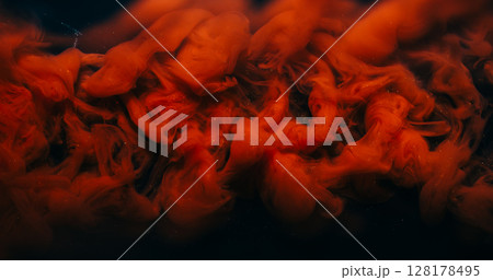 Paint drop. Fog background. Defocused bright red color swirling vapor fume liquid floating on dark black acrylic creative abstraction. 128178495