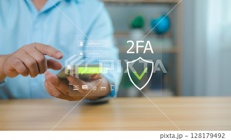 Secure online access, data protection, and privacy technology. Cybersecurity and digital safety concept. Man using smartphone for two-factor authentication login with virtual interface. Secure online access, data protection, and privacy technology. Cybersecurity and digital safety concept. Man using smartphone for two-factor authentication login with virtual interface. 128179492