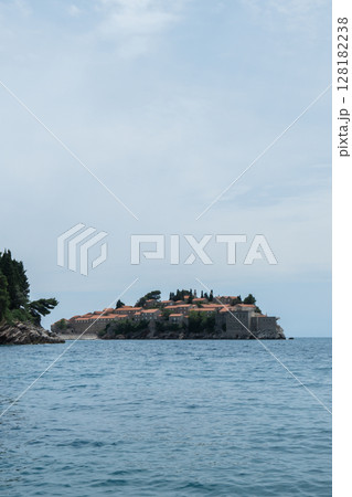 Sveti Stefan private island in Montenegro near Budva. Adriatic Sea Coast travel destination vacation holiday idea. Concept of getting away tourism experiences. Nature driven scenery 128182238
