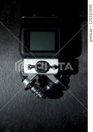 Handy recorder device on a black background. Top view 128183098