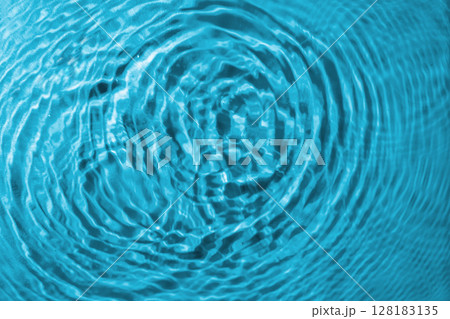 Blue water texture background. Clean transparent water surface with rings and ripples. Summer concept. Flat lay Blue water texture background. Clean transparent water surface with rings and ripples. Summer concept. Flat lay 128183135