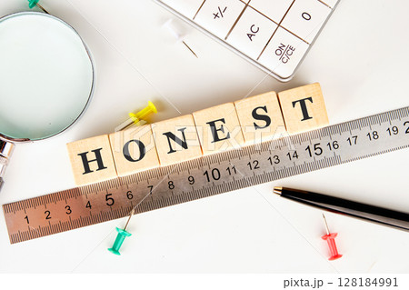 The concept word HONEST is assembled from cubes. Business integrity ethics honesty respect concept The concept word HONEST is assembled from cubes. Business integrity ethics honesty respect concept 128184991