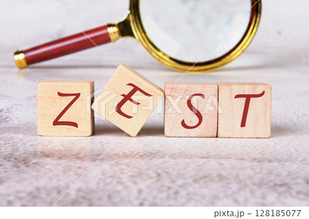 The concept word ZEST is assembled from wooden cubes. emphasizing motivation and creativity concept 128185077