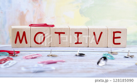 The concept word MOTIVE is assembled from wooden cubes. business motivational concept 128185090