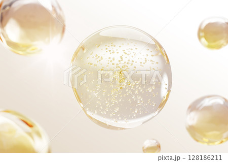 3d gold liquid serum, cosmetic oil texture with bubbles on light yellow background. Skin care product with clear ball drops of gel, essence. Collagen cell pattern with water molecules. 3D illustration 3d gold liquid serum, cosmetic oil texture with bubbles on light yellow background. Skin care product with clear ball drops of gel, essence. Collagen cell pattern with water molecules. 3D illustration 128186211