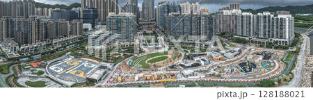 July 1 2025 Modern Urban Neighborhood with Green Space and High-Rise Buildings 128188021